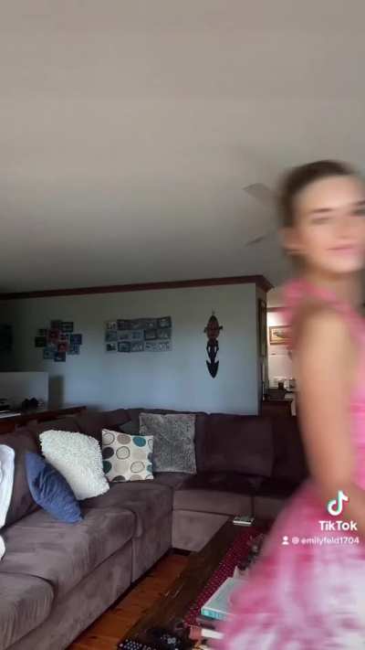 Showing off her couch.....and also some dresses ...(