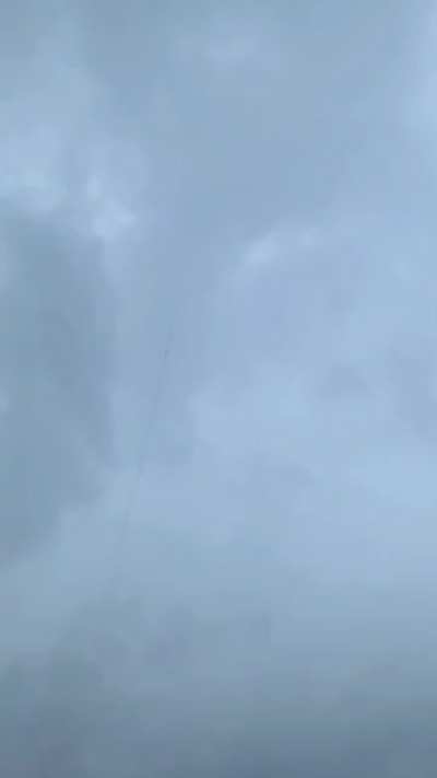 Lightning bolt taking the path of rocket's exhaust