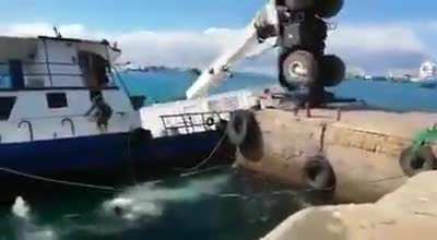 Talk about a bad work day losing your ship, cargo container, and crane all in one day