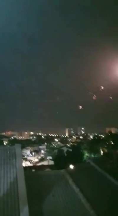On the left side: rockets launched from Gaza On the right side: Iron Dome in action to meet those rockets.