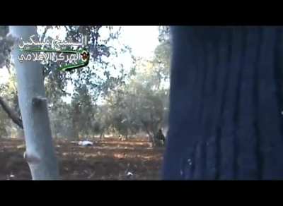 FSA fighters are caught out in a field & retrieve the body of a fallen comrade under fire near al-Shaykh Maskin - 2014