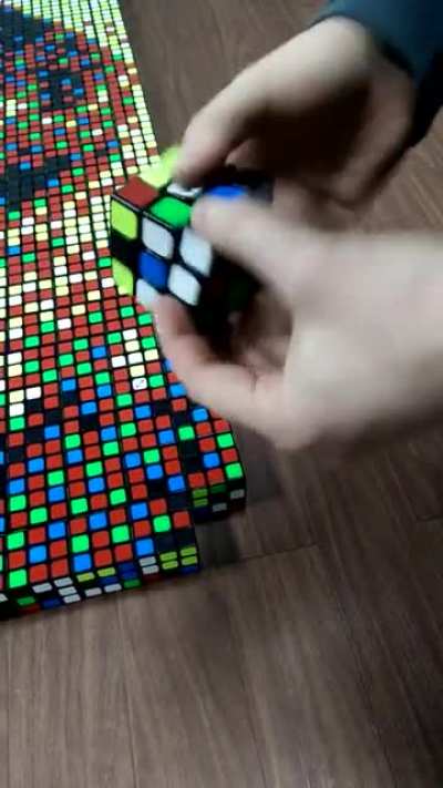 Man makes mosaic using Rubik's Cubes