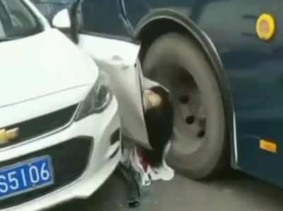 Woman gets out of her car, immediately hit by a bus