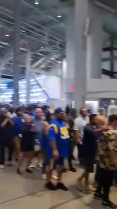 People lining up for escalator, instead of just using the stairs