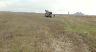 Ukrainian forces preparing rockets filled with written instructions on how to surrender, and firing them at Russian positions in Bakhmut