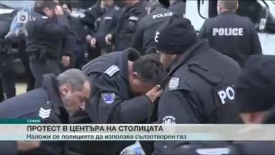 Bulgarian police uses pepper spray on protestors in front of the parliament. They forget to take the wind into account.