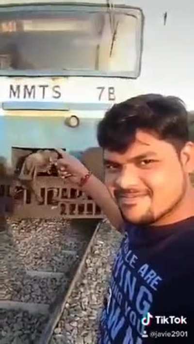 Taking a selfie near train tracks