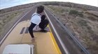 Jumping off a moving bus off of a bridge