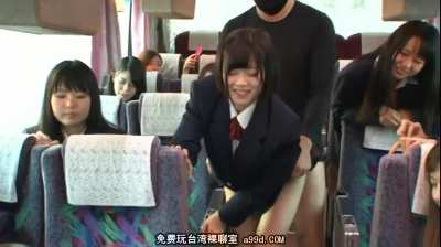 Students play cards on the bus