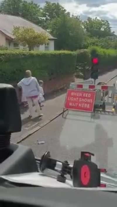 Pedestrian stops for temporary traffic lights set up to control traffic