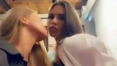 Kissing her girlfriends