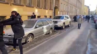 Anti-war protesters in Saint Petersburg confront Russian police attempting to arrest them.