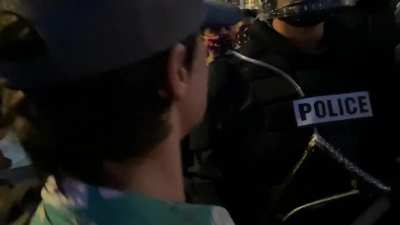 Armed protestors confront riot police in San Antonio, side by side with unarmed protestors, pledging to protect the rights and lives of the people.
