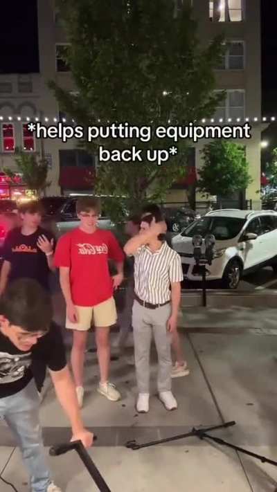 Main character knocks down street performers keyboard