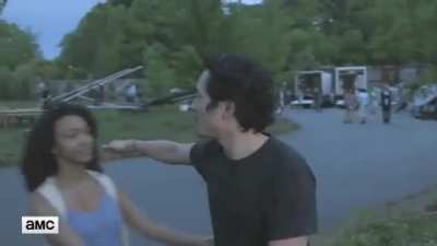 People keep interrupting Steven Yeun during an interview and kissing him