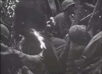 US Marines using Molotov cocktails to root out a stubborn enemy on Peleliu, September 1944.