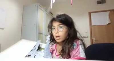 This girl trying to show off her puzzle