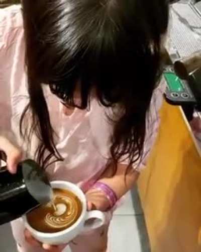 9 Year old kid is proud of her coffee art