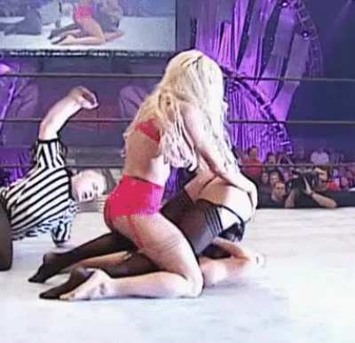 Torrie Wilson Spanking Stacy Keibler’s lingerie clad Booty!