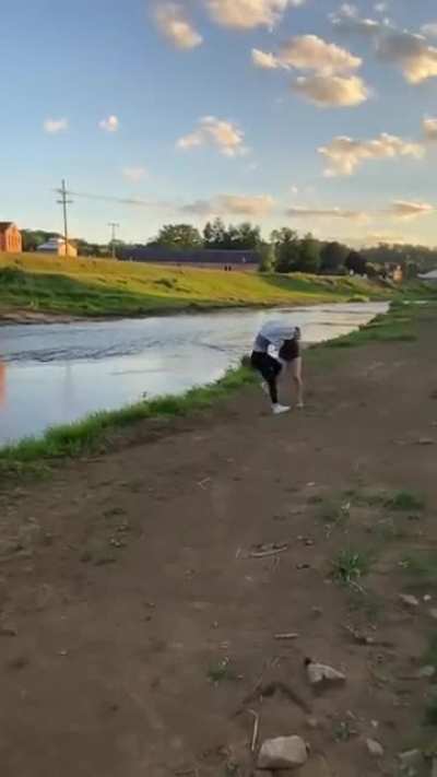 by the water