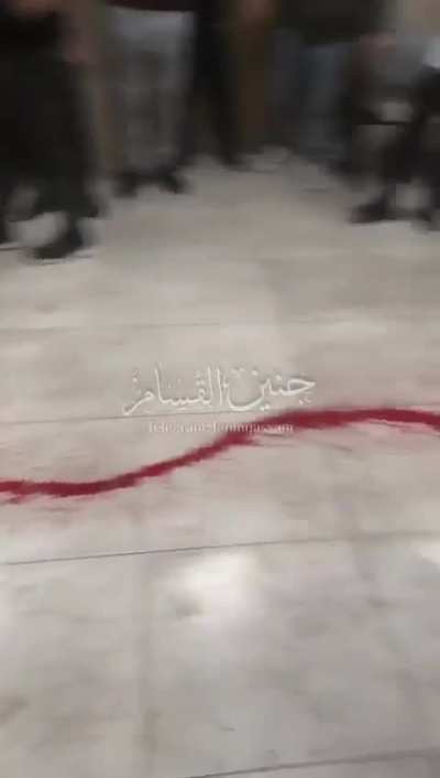 Shooting a civilian in the doorway to Jenin Government Hospital
