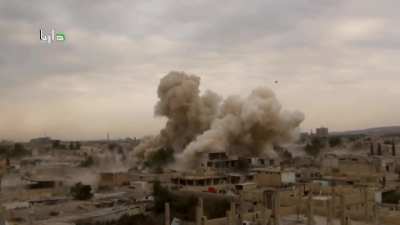 SyAAF helicopter drops a pair of improvised bombs which tumble end-over-end onto Daraya, Damascus - 11/3/2015