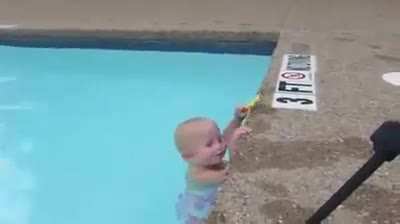 16 month-old baby girl swims like a Champ.