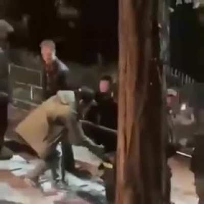 Keanu Reeves assisting crew in moving the equipment