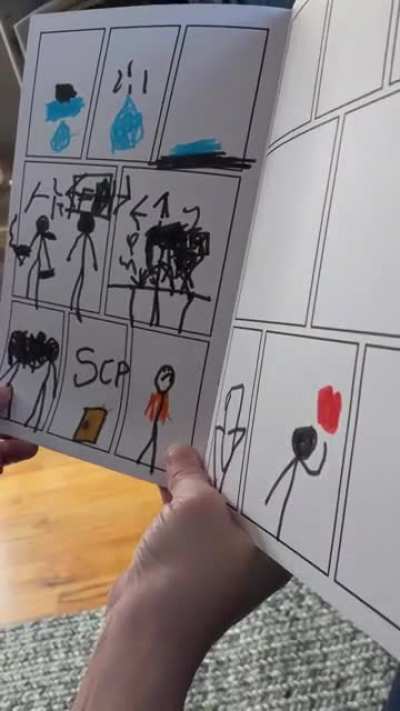 My son showing me his comic book he made.