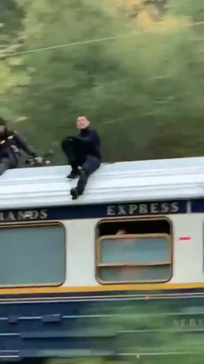 Tom Cruise on top of a moving train in rural Norway