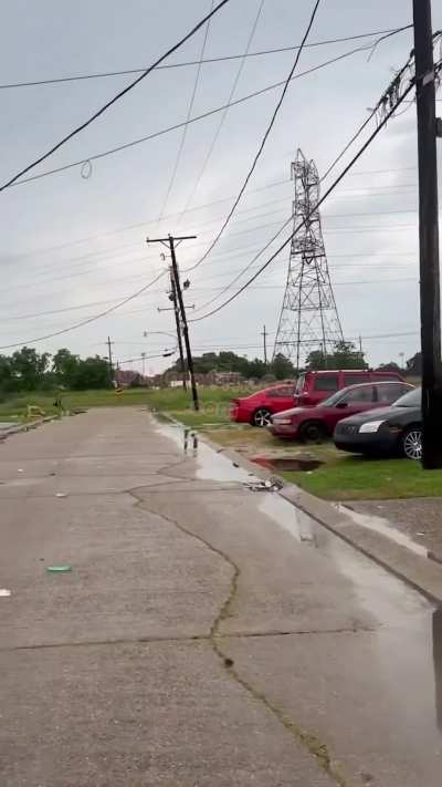 Woman chases and shoots at another woman while being chased by police officer.