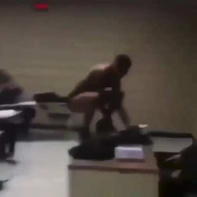 Kid does very strange dances on teachers desk