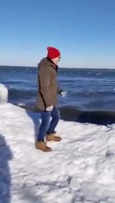 WCGW testing the strength of an ice ledge while standing on it