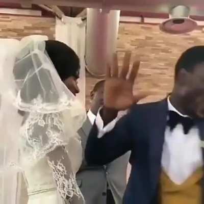 Groom's reaction as he unveils his bride