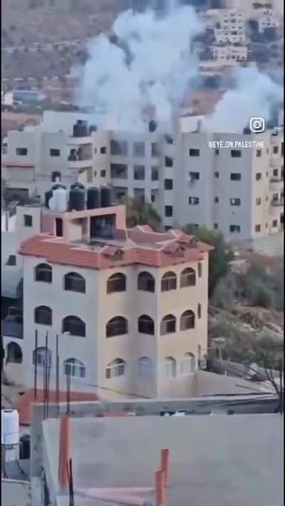 The Israeli occupation forces blow up an apartment during a raid on Tubas city.
