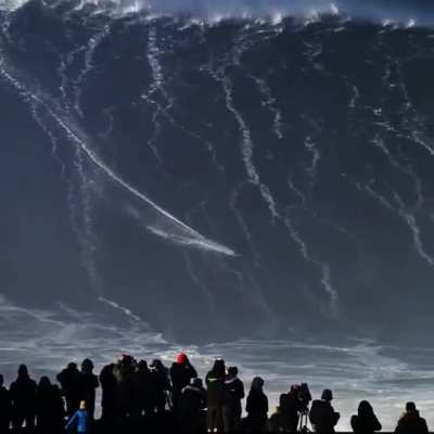 Brazilian surfer Rodrigo Koxa rides a massive wave in Nazare