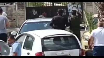 Suicde grenadier outside a syrian embassy gate or courthouse