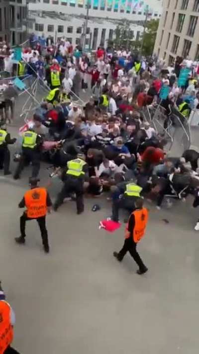 Fans force their way into Wembley amid chaotic scenes before England-Italy is to kick off.