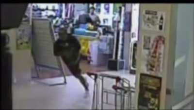 Silly purse snatcher smacks into glass wall