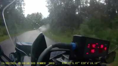 Police bike chases white Mercedes in Narva, Estonia