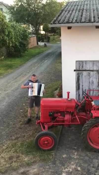 This guy plays the accordion on an ordinary drum kit