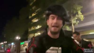 Mason the photographer getting confronted, and later beaten, for allegedly sending photos to the police