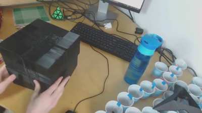 Corenpuzzle making the first turn on his 22x22 3D printed rubik's cube after several hours of assmbly