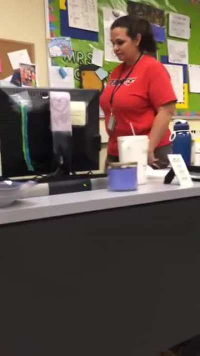 Student hides under desk and grabs teacher's ankle