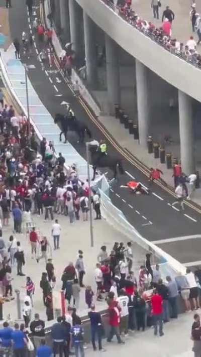 More fans knock down the gates and storm Wembley