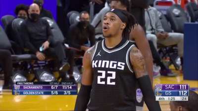 Oubre distracting Holmes at the free throw line.