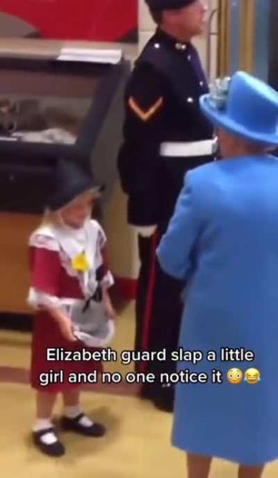 The Queens guard accidentally slaps a kid! The kid is clearly in pain, but the show must go on haha!