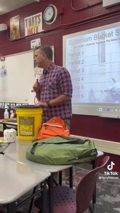 A teacher explains the 'Yellow Bucket' in the classroom