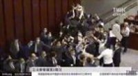 Pro-Beijing councilor Aron Kwok assaults pro-democracy councilor Raymond Chan, as pro-Beijing lawmakers hijack Hong Kong Legislative Council meeting