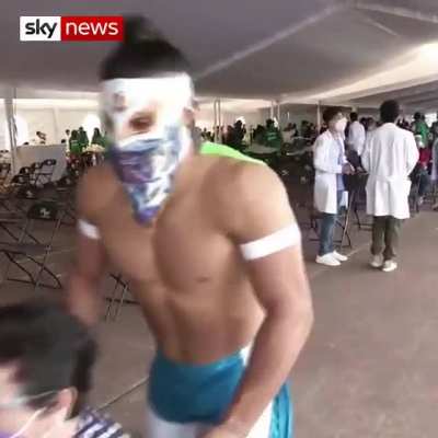 Mexican Wrestlers assist with Covid Vaccinations!